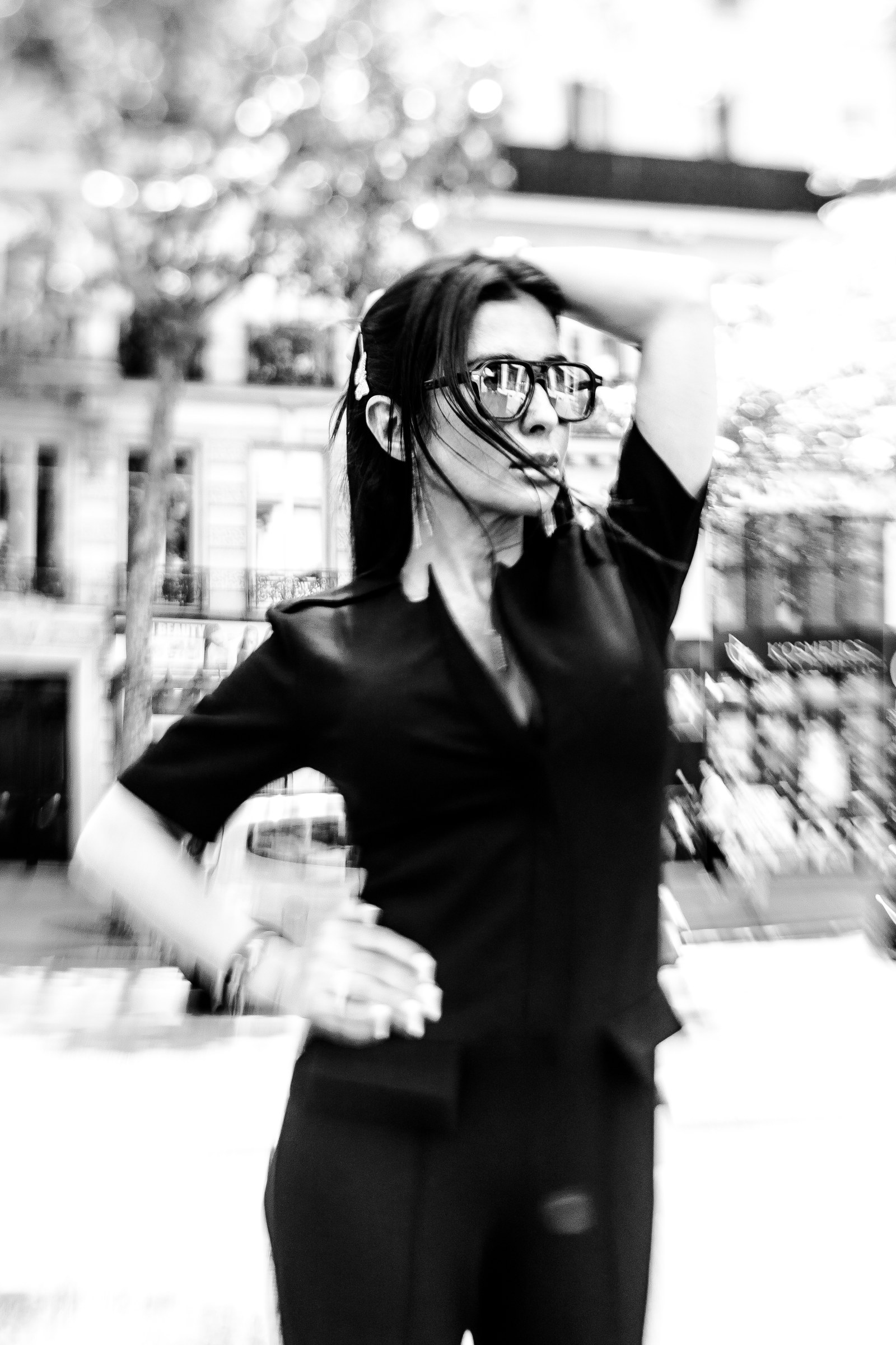Shana Mak on a boulevard, hand in her hair
